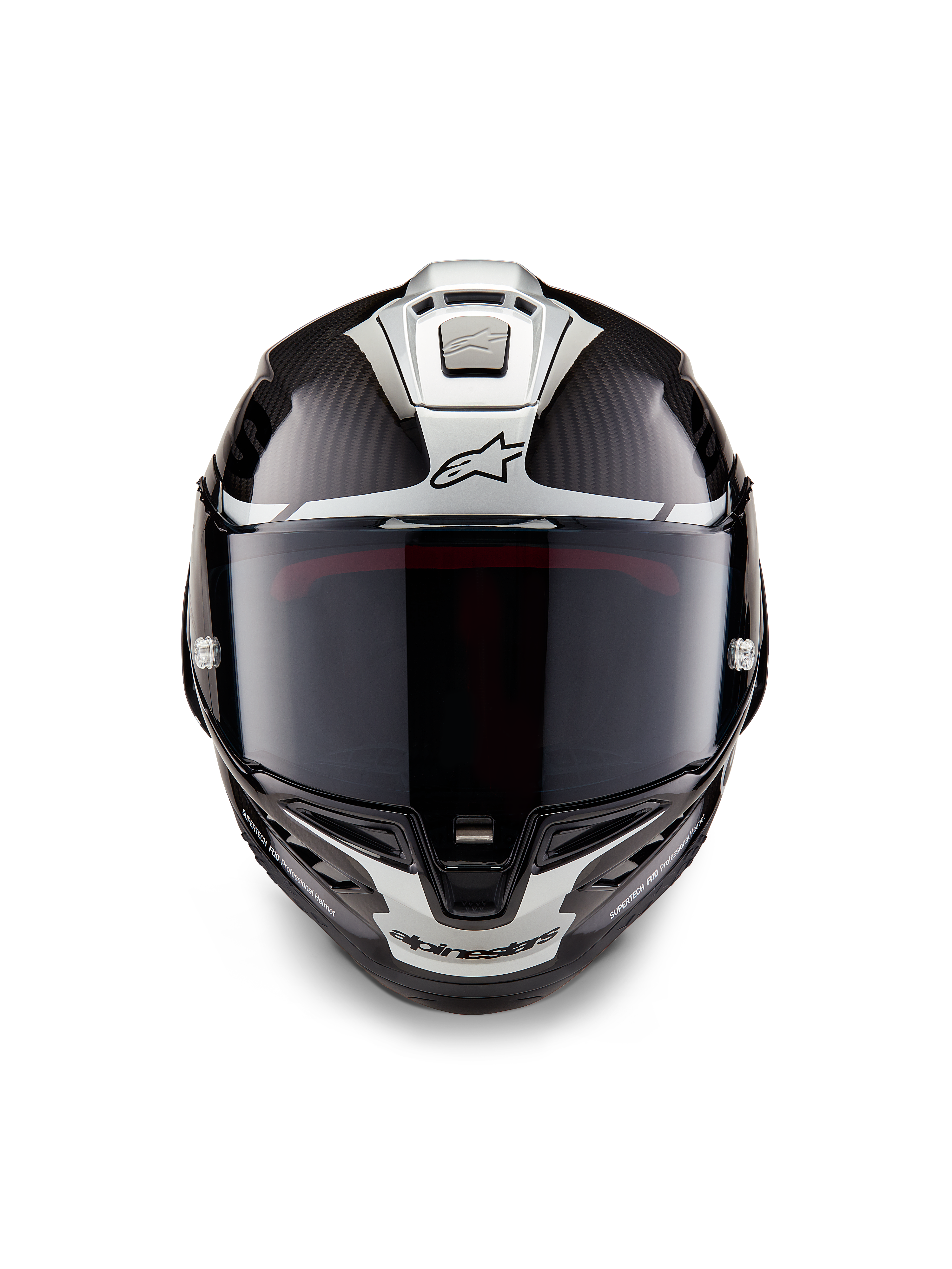 Casque Alpinestars Supertech R10 Element, casque intégral de course, noir carbone argent noir brillant, vue de face montrant la visière fumée foncée et la structure en fibre de carbone brillante avec des graphismes aérodynamiques argentés et les logos Alpinestars
