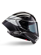 Casque Alpinestars Supertech R10 Element, casque intégral de course moto, finition carbone noir, argent et noir brillant, vue de profil avec coque aérodynamique en fibre de carbone, visière transparente et logo Alpinestars distinctif