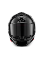 Casque Alpinestars S-R7 Solid, casque de moto intégral, noir brillant, vue de face avec visière teintée foncée, coque aérodynamique épurée avec ventilations sur la mentonnière et le dessus, logo Alpinestars argenté discret sur le front.