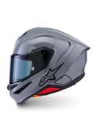 Casque Alpinestars S-R7 Solid, casque de moto intégral, gris brillant, profil latéral montrant un design aérodynamique épuré avec spoiler intégré, logo étoile noir et accent rouge à la base