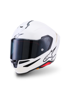 Casque Alpinestars S-R7 Solid, casque de moto intégral, blanc brillant, visière fumée foncée, logo étoile noir sur le front et le côté, coque aérodynamique avec évents de ventilation et accents rouges, équipement de route et de course haute performance
