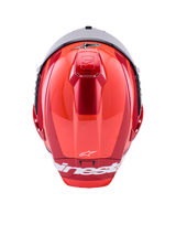 Alpinestars Supertech R10 Arius Helmet, Full-Face Racing Helmet, Red Glossy with White Accents, top view showing aerodynamic shell contours, white Alpinestars branding, and integrated top ventilation