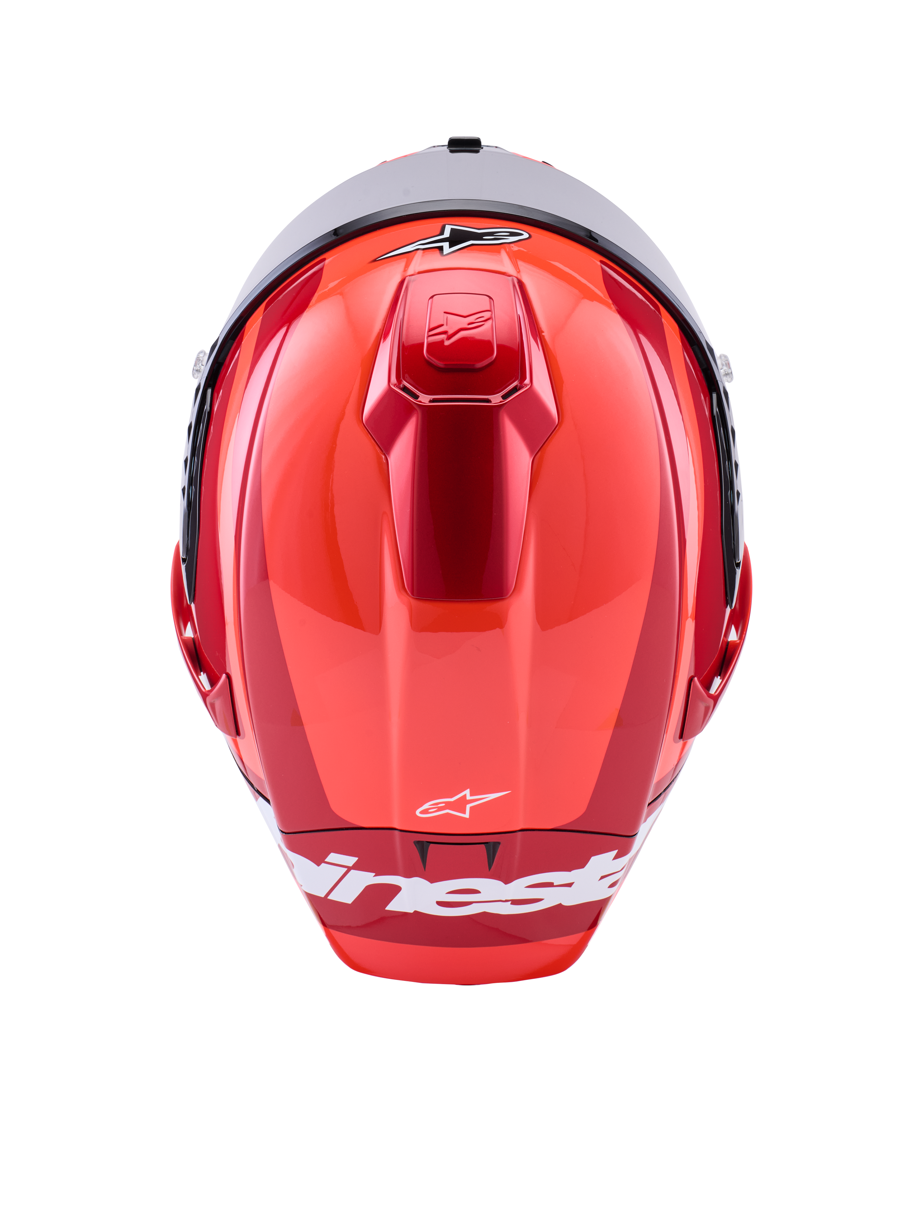 Casque Alpinestars Supertech R10 Arius, casque de course intégral, rouge brillant avec accents blancs, vue de dessus montrant les contours aérodynamiques de la coque, logo Alpinestars blanc et ventilation supérieure intégrée