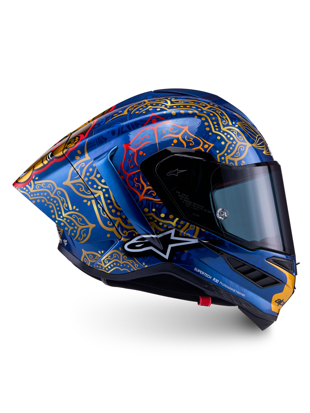 Supertech R10 Martinator Thai Helmet in glossy blue carbon with intricate gold mandala graphics and a racing profile.