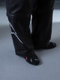 Alpinestars RSRV Starline Shoes, chaussures lifestyle premium, noires avec détails blancs et rouges, design urbain avec logo graphique, construction textile lisse et brillante