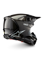 Alpinestars Casque Supertech M10 Solid ECE 22.06, casque de motocross noir carbone brillant, vue de profil avec coque en carbone, aérations et visière pare-soleil, certifié ECE