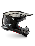 Casque Alpinestars Supertech M10 Solid ECE 22.06, casque de motocross tout-terrain noir en carbone brillant, vue de profil avec visière et ouvertures de ventilation