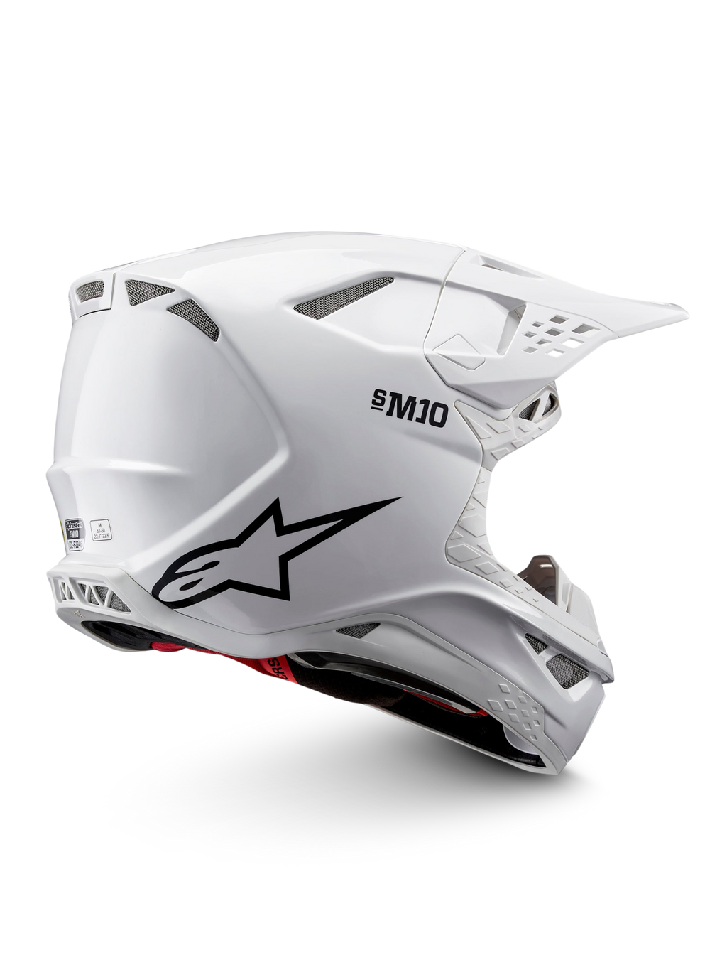 Casque Alpinestars Supertech M10 Solid ECE 22.06 de motocross, blanc brillant avec graphismes noirs, accents rouges, ouvertures de ventilation et visière pare-soleil