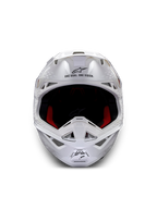 Alpinestars Supertech M10 Solid ECE 22.06, casque de motocross blanc brillant, vue de face avec rembourrage intérieur rouge et noir