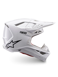 Casque Alpinestars Supertech M10 Solid ECE 22.06, casque de motocross blanc brillant avec logo noir, visière et conception intégrale ventilée, vue de profil