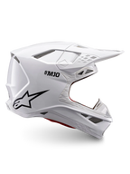 Casque Alpinestars Supertech M10 Solid ECE 22.06, casque de motocross blanc brillant avec logo noir, visière et conception intégrale ventilée, vue de profil
