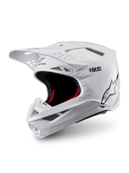 Alpinestars Supertech M10 Solid ECE 22.06, casque de motocross blanc brillant, intérieur noir et rouge, visière et ouvertures de ventilation, vue trois quarts