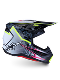 Casque Alpinestars S-M7 Blaster ECE 22.06, casque de motocross noir et gris avec jaune fluo et rose, design aérodynamique.