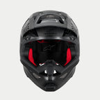 Alpinestars Supertech M10 Fame ECE 22.06 Helmet, Motocross Helmet, Black Carbon Matte and Glossy, front view with visible red interior padding, aerodynamic carbon fiber shell, ventilated design for off-road racing