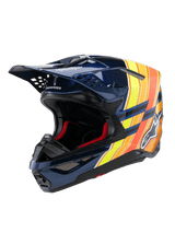Casque Alpinestars Supertech M10 TLD Edition 25, casque de motocross, bleu foncé brillant avec graphismes orange et jaune fluo, doté d'un rembourrage intérieur rouge, coque aérodynamique avec plusieurs orifices de ventilation, logo Troy Lee Designs sur la visière, équipement professionnel de course tout-terrain