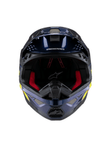 Casque Alpinestars Supertech M10 TLD Edition 25, casque de motocross, bleu foncé métallisé brillant avec rembourrage intérieur rouge, vue de face montrant les grilles de ventilation et les graphismes latéraux jaunes et oranges, protection haut de gamme pour la course tout-terrain.