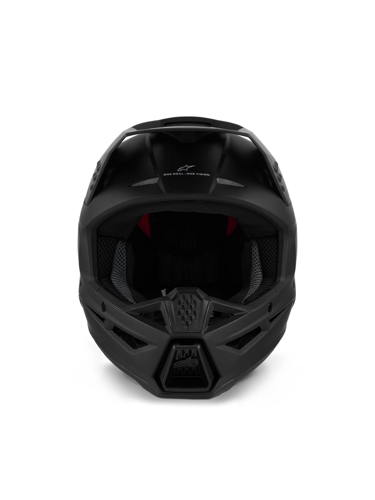 Casque Alpinestars S-M3 Solid ECE 22.06, casque de motocross, noir mat, vue de face montrant la ventilation agressive de la mentonnière et le marquage 'ONE GOAL - ONE VISION', design épuré pour les courses tout-terrain