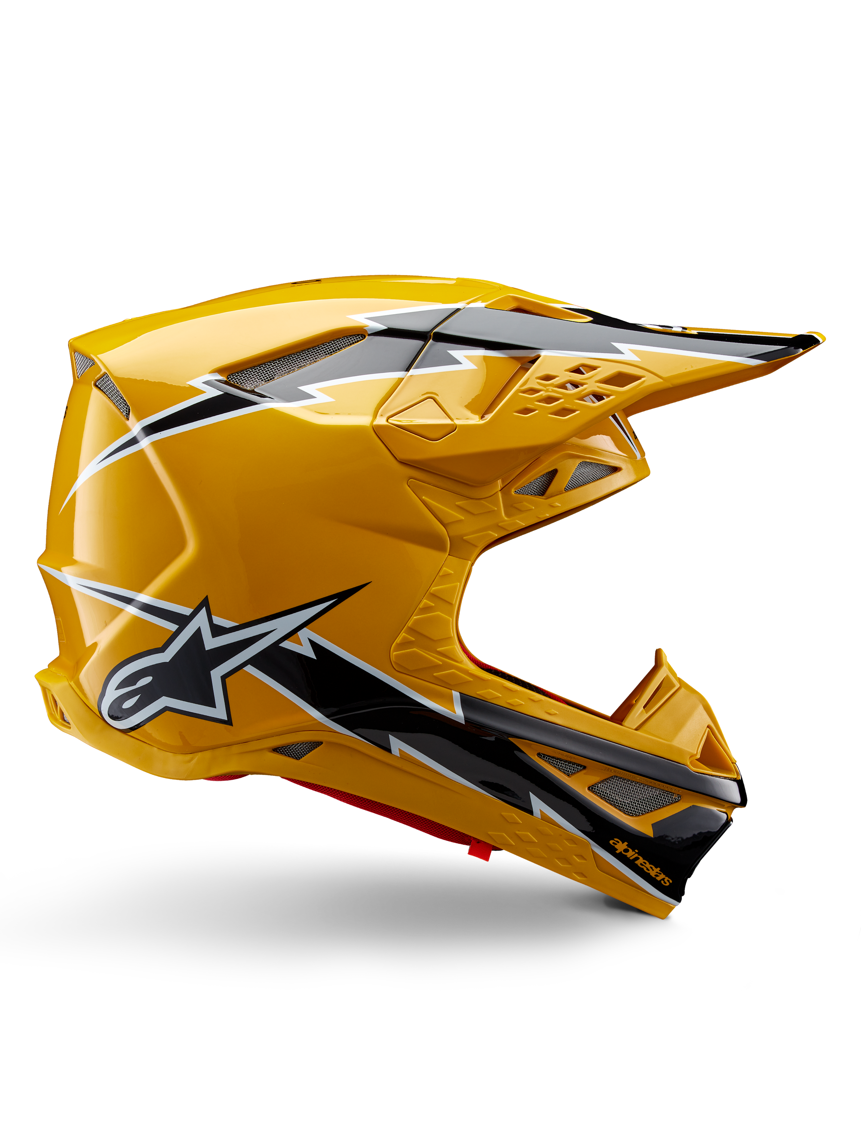 Casque Alpinestars Supertech M10 Ampress, casque de motocross, noir et jaune brillant, profil latéral montrant des graphismes d'éclairs noirs et blancs, logo étoile Alpinestars, design aérodynamique avec ports de ventilation intégrés et visière réglable.
