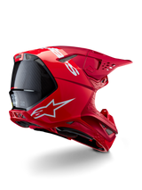 Casque Alpinestars Supertech M10 Flood, casque de motocross, rouge et rouge fluo, finition mate et brillante, vue de profil arrière avec logo Alpinestars blanc et accents en fibre de carbone, design aérodynamique avec de multiples ports de ventilation, protection de tête tout-terrain haute performance