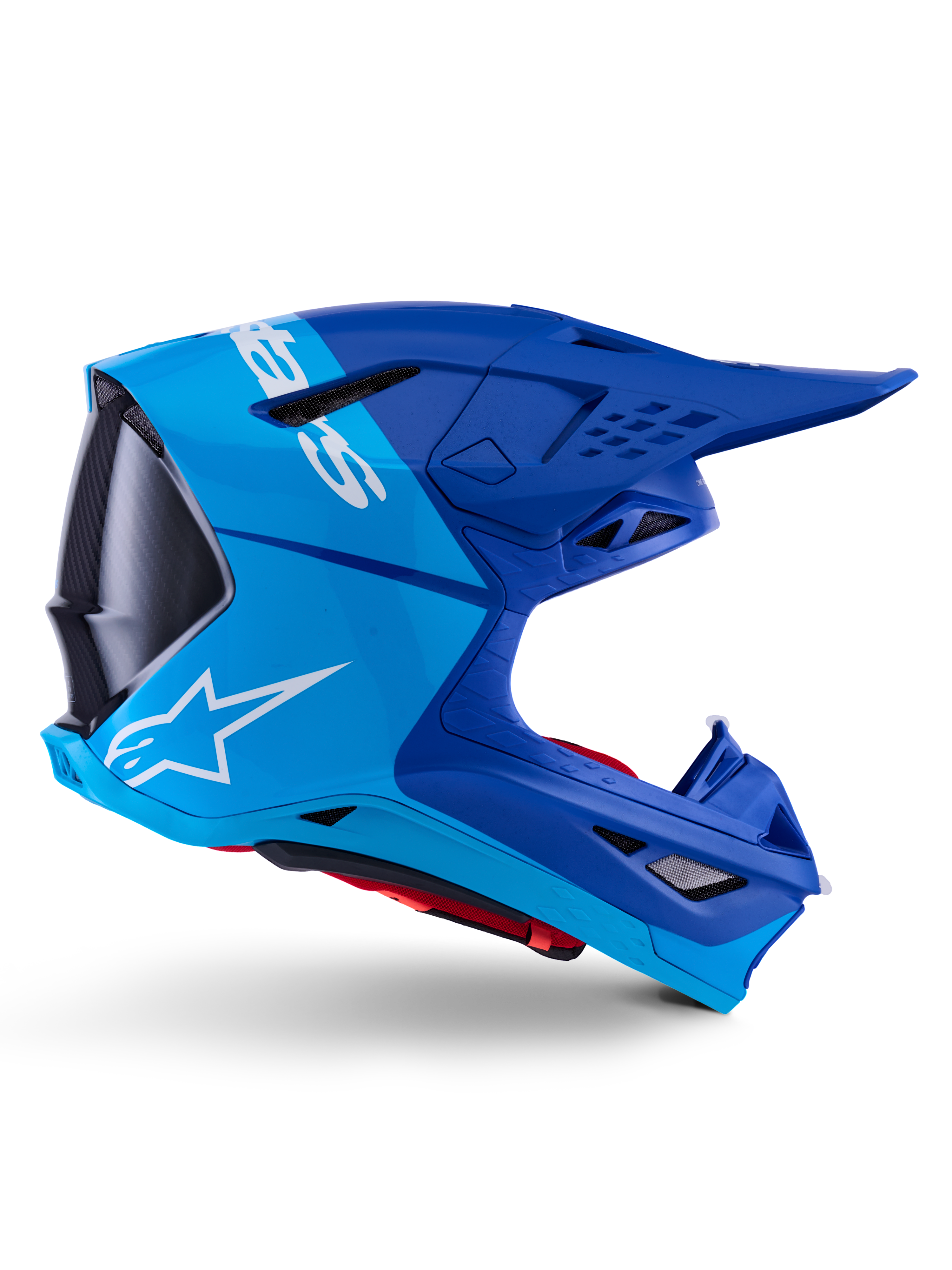 Casque Alpinestars Supertech M10 Flood, casque de motocross, bleu métallique et bleu moyen avec accents en carbone noir, vue de profil, logo blanc, design aérodynamique avec ports de ventilation, détails de texture en fibre de carbone, protection professionnelle pour la course tout-terrain