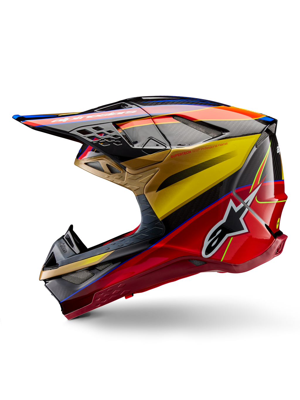 Casque Alpinestars Supertech M10 Era, casque de motocross, or jaune et rouge Rio brillant, profil latéral avec texture en fibre de carbone et graphismes audacieux, logo étoile Alpinestars, forme aérodynamique avec de nombreux orifices de ventilation, protection professionnelle pour la course tout-terrain