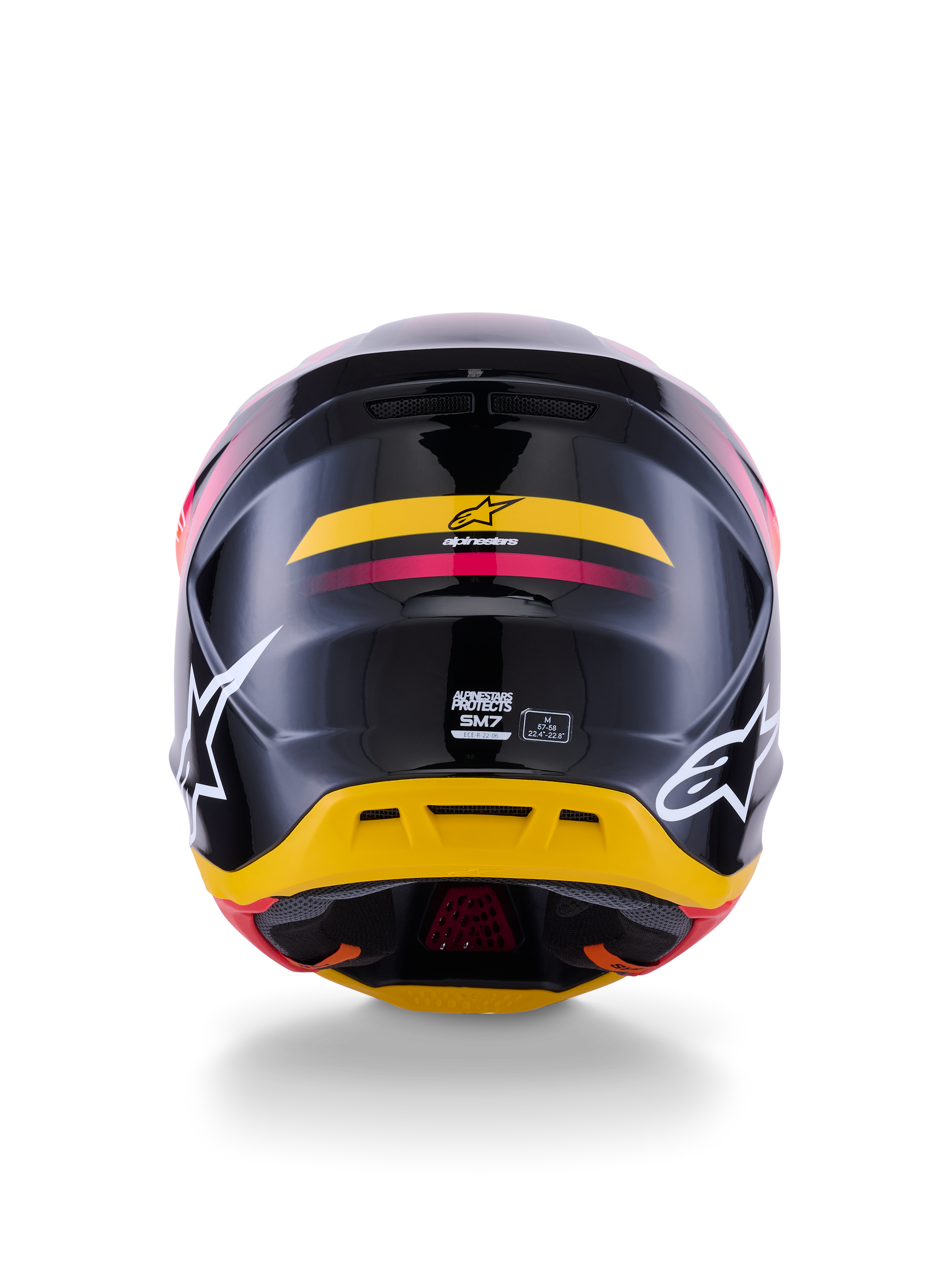 Casque Alpinestars S-M7 Rise ECE 22.06, casque de motocross, vue arrière, noir brillant avec des touches de jaune et de rose, grands logos blancs sur les côtés, coque composite aérodynamique, équipement de course tout-terrain