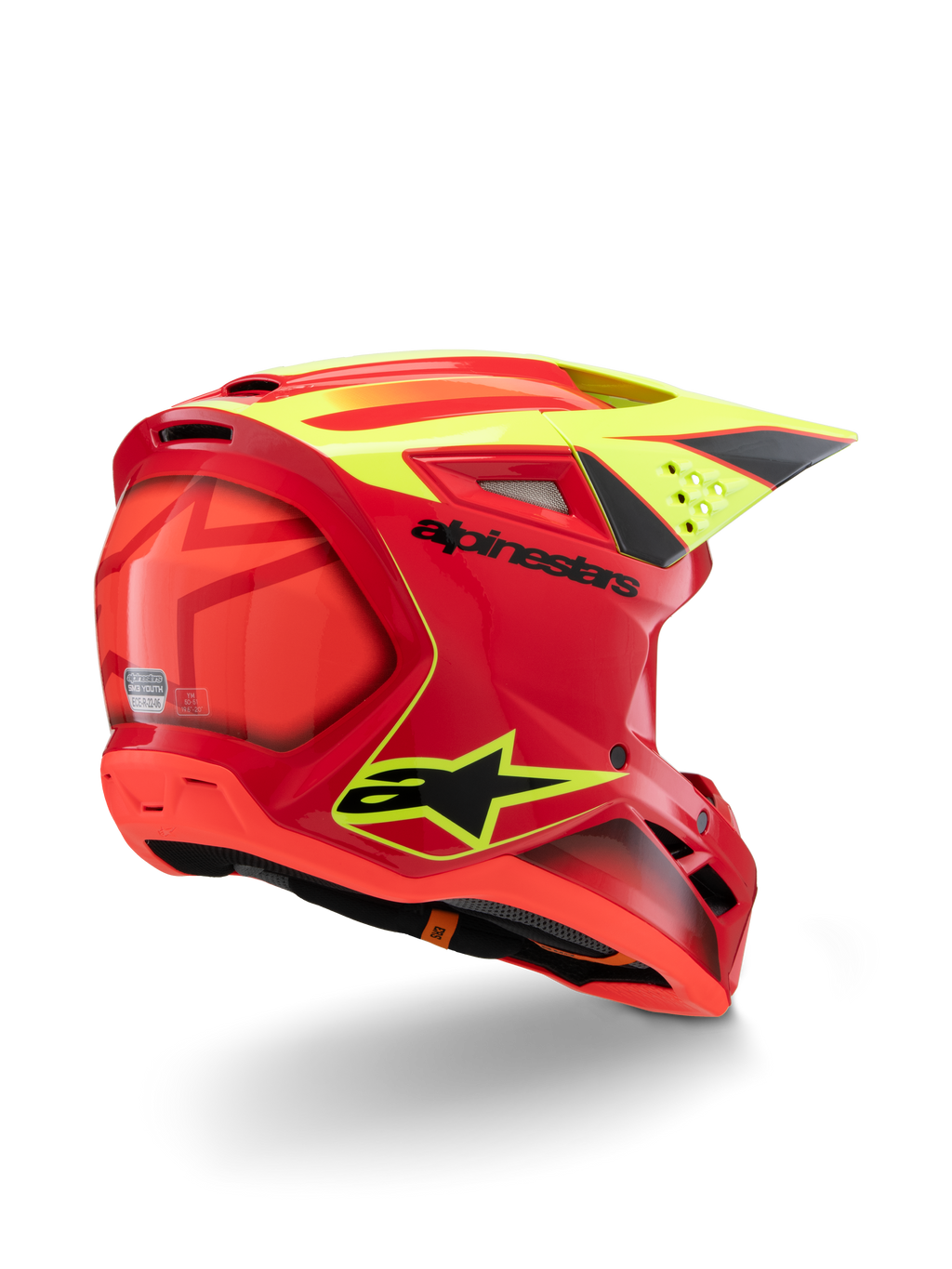 Casque Alpinestars S-M3 Youth Fray, rouge et jaune fluo brillant, vue de trois-quarts arrière, avec logos noirs imposants et aérations aérodynamiques, casque de motocross haute visibilité pour enfant