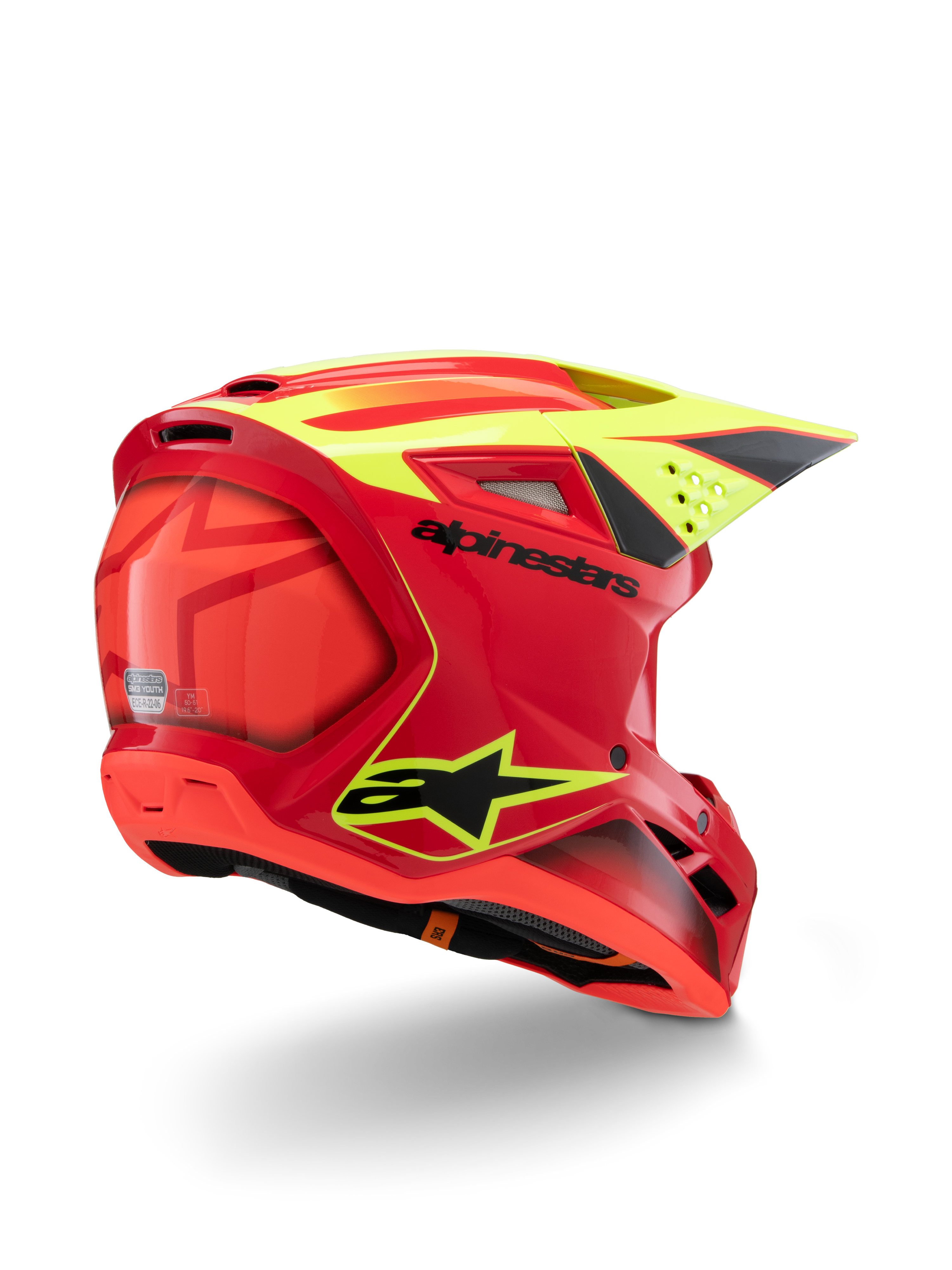 Casque Alpinestars S-M3 Youth Fray, rouge et jaune fluo brillant, vue de trois-quarts arrière, avec logos noirs imposants et aérations aérodynamiques, casque de motocross haute visibilité pour enfant