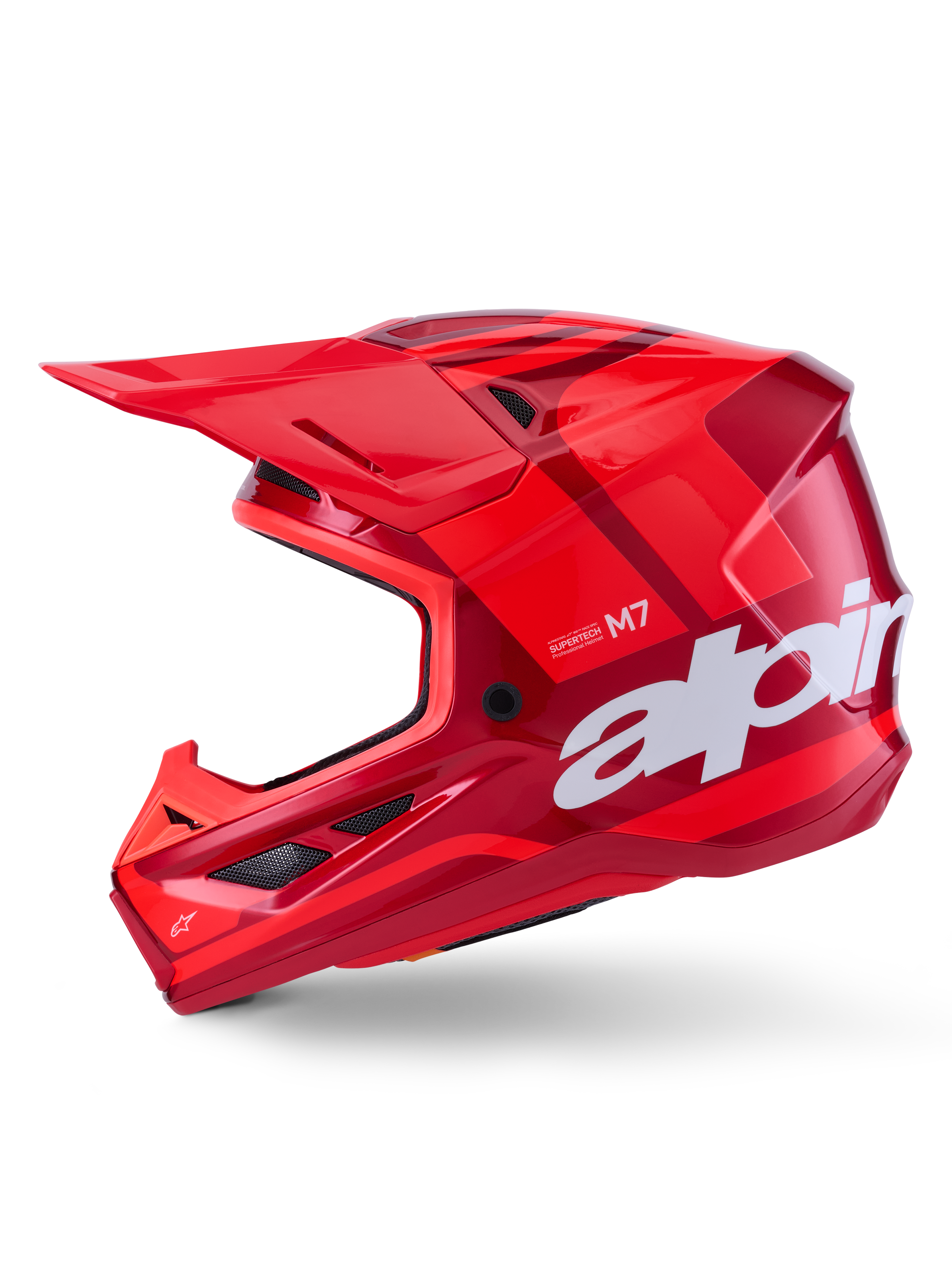 Alpinestars S-M7 Core Helmet, Red Glossy with geometric accents, Motocross Helmet, side profile view, aerodynamic shell with ventilation ports and white branding, high-performance off-road racing gear