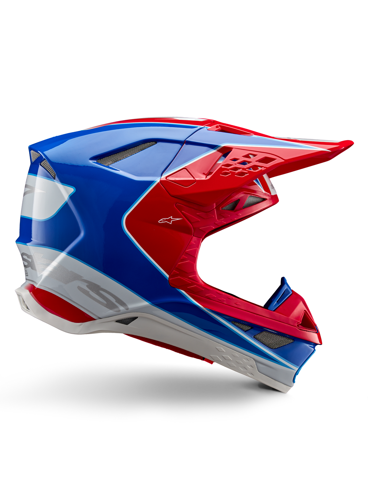 Alpinestars Supertech M10 Aeon, casque de motocross, rouge vif, bleu et blanc, finition brillante, profil latéral aérodynamique avec de multiples aérations en mesh, contours angulaires et visière