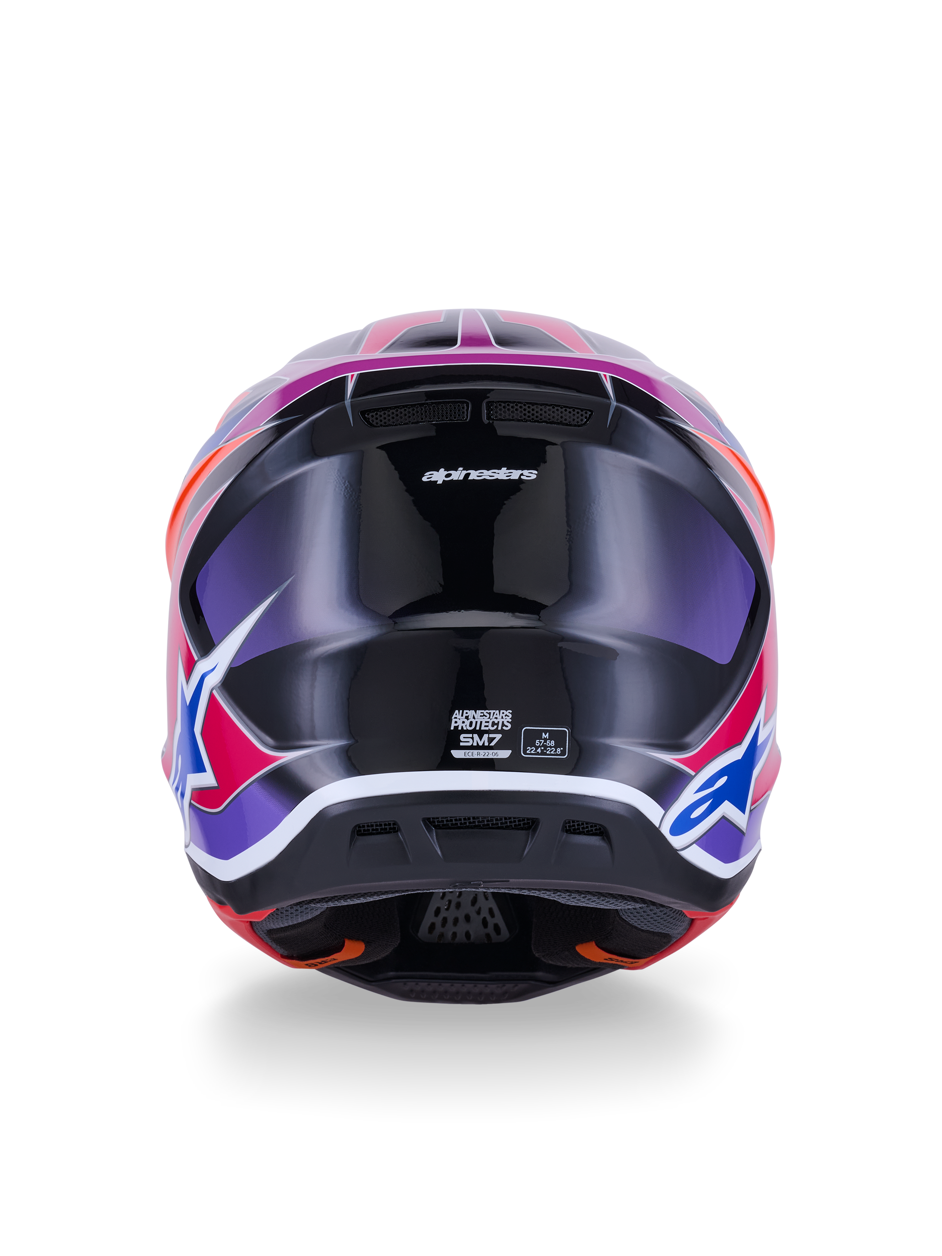 Casque Alpinestars S-M7 Fuse, casque de motocross, vue arrière, bleu, violet et rose brillant, graphismes rose et violet éclatants sur une coque noire brillante, avec ports de ventilation et étiquette de certification ECE 22.06