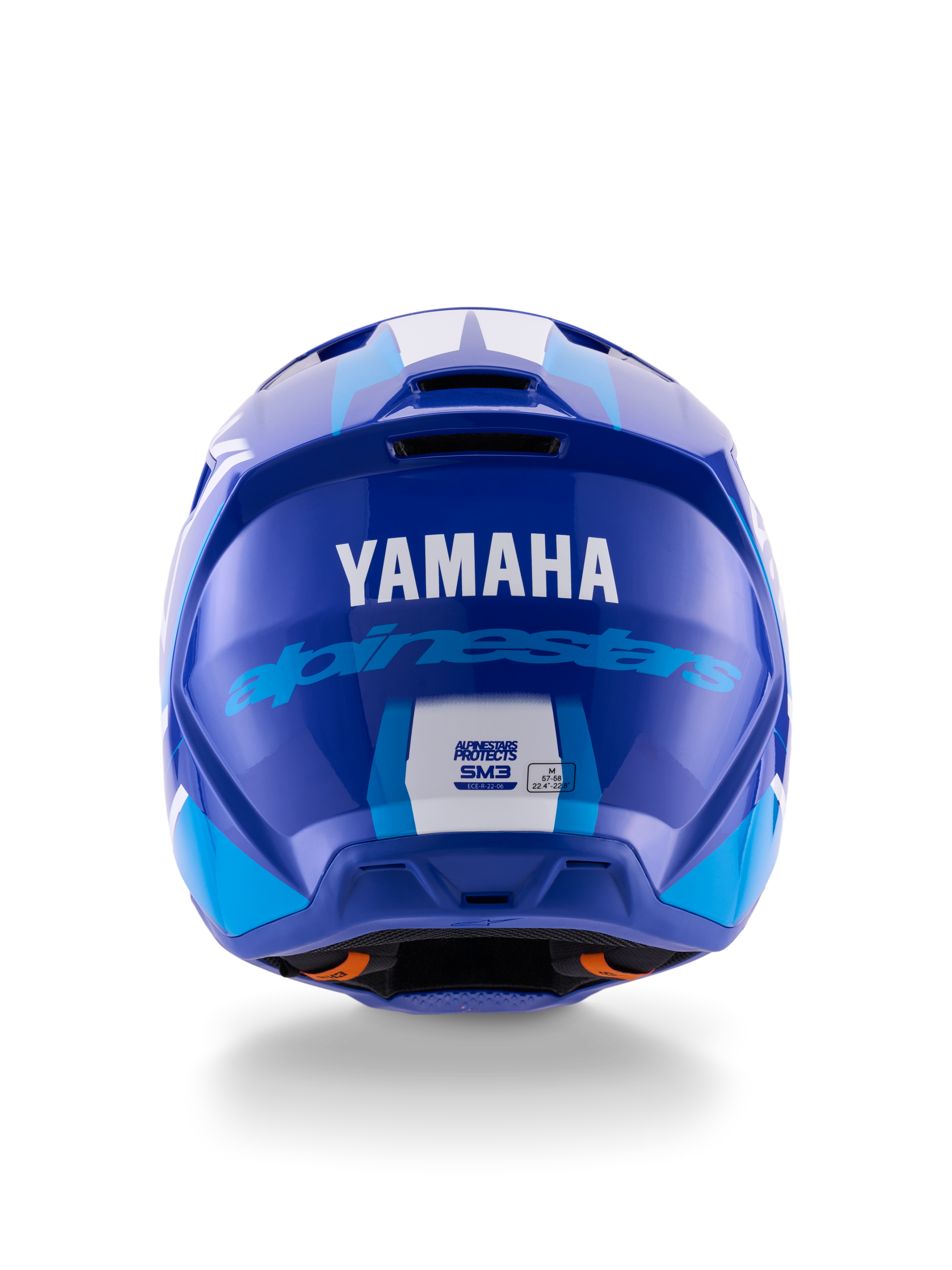 Casque Alpinestars Yamaha S-M3, casque de motocross, bleu et blanc brillant, vue arrière montrant le logo YAMAHA blanc et l'inscription Alpinestars bleue, finition brillante élégante avec ports de ventilation et étiquettes de certification de sécurité.