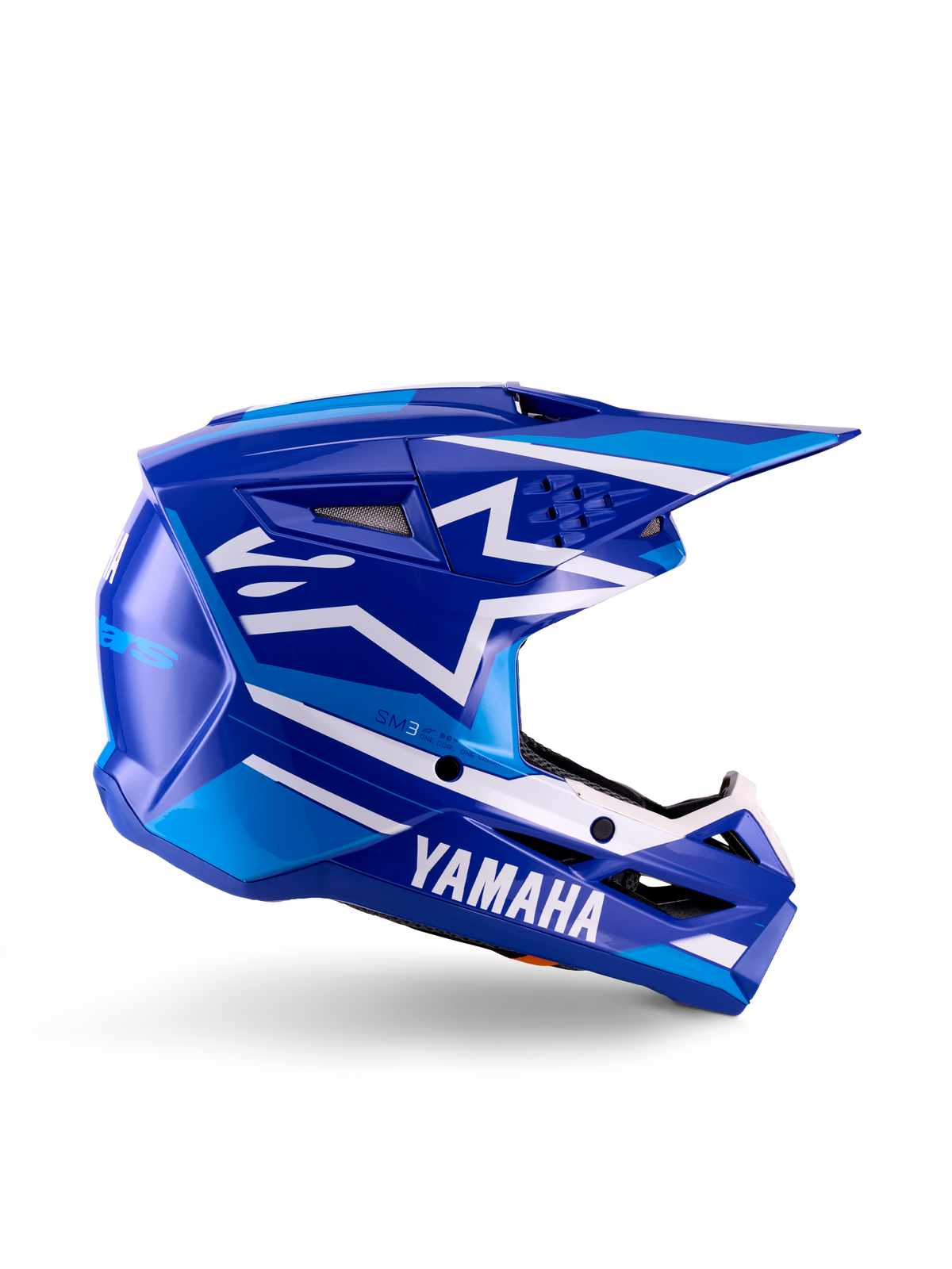 Yamaha S-M3 Youth Motocross Helmet, Blue and White Glossy, side profile view featuring bold Yamaha branding and Alpinestars star logo, geometric design with light blue accents, ventilated shell with long visor, ECE 22.06 certified off-road head protection