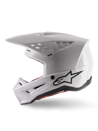 Alpinestars S-M5 Solid Helmet ECE 22.06, casque de motocross, blanc brillant, vue de profil avec design de coque angulaire, logo Alpinestars noir sur le côté, multiples orifices de ventilation et visière intégrée pour la course tout-terrain.