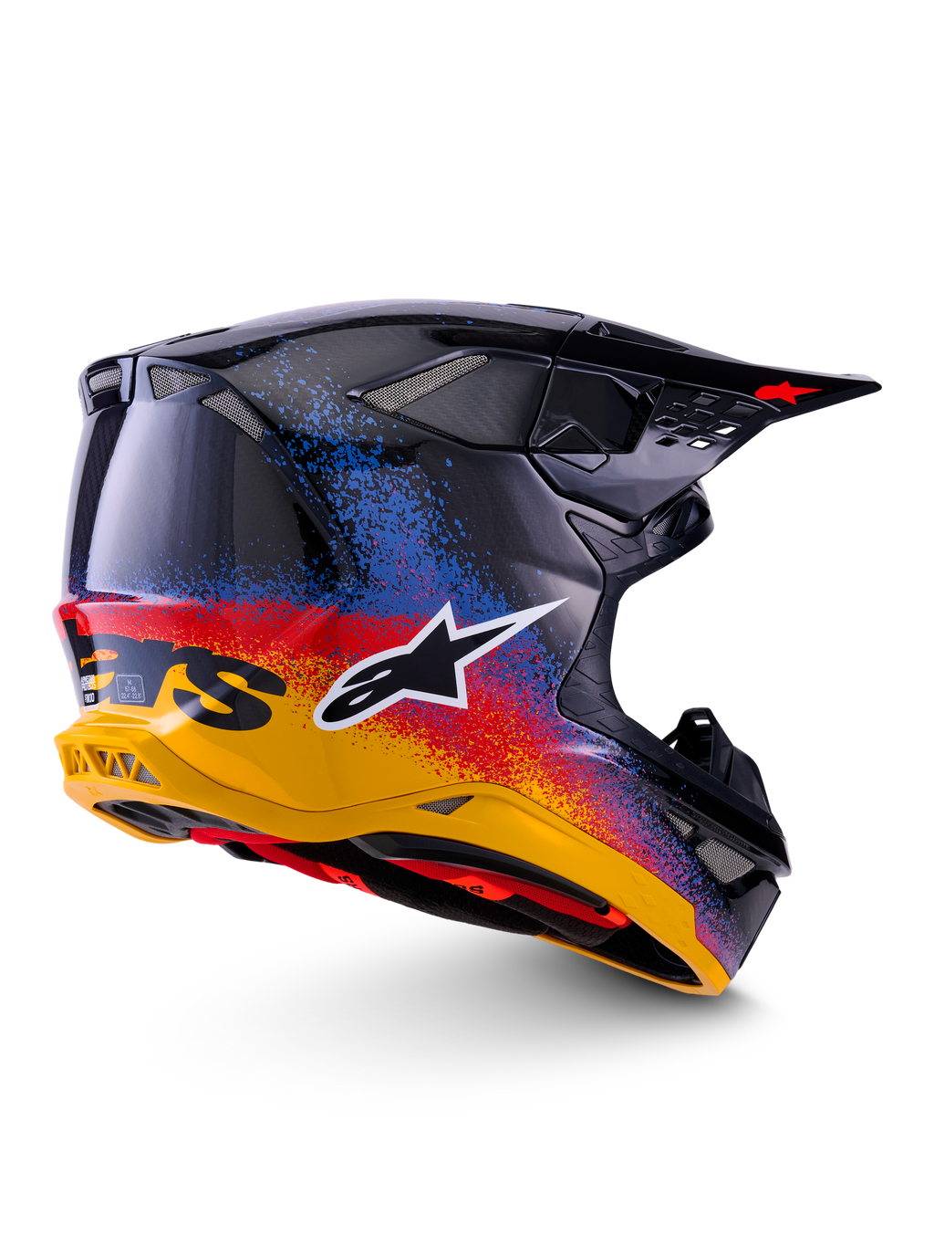 Alpinestars Limited Edition Supertech M10 Black Hole Helmet, Motocross Helmet, Black Burst Glossy featuring a vibrant yellow to red and blue speckled gradient, lightweight carbon fiber shell with white A-star logo and integrated mesh exhaust vents