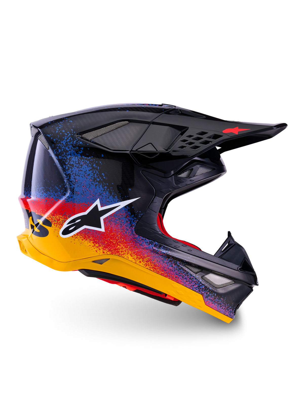 Alpinestars Limited Edition Supertech M10 Black Hole, casque de motocross, coque noire avec motifs d'éclaboussures dégradés rouges, bleus et jaunes, logo étoile blanc sur le côté, profil aérodynamique avec orifices de ventilation grillagés, rembourrage intérieur rouge et longue visière noire