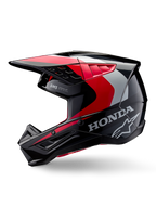 Casque Alpinestars Honda S-M5, casque de motocross, noir, rouge et argent brillant, vue de profil avec logos Honda et Alpinestars, design profilé avec visière intégrée et ports de ventilation pour la performance tout-terrain