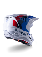 Alpinestars Honda S-M5 Helmet ECE, casque de motocross, blanc, bleu et rouge brillant, avec marquage Honda et logos Alpinestars, coque aérodynamique avec ports de ventilation intégrés et visière réglable, équipement de protection pour la course tout-terrain