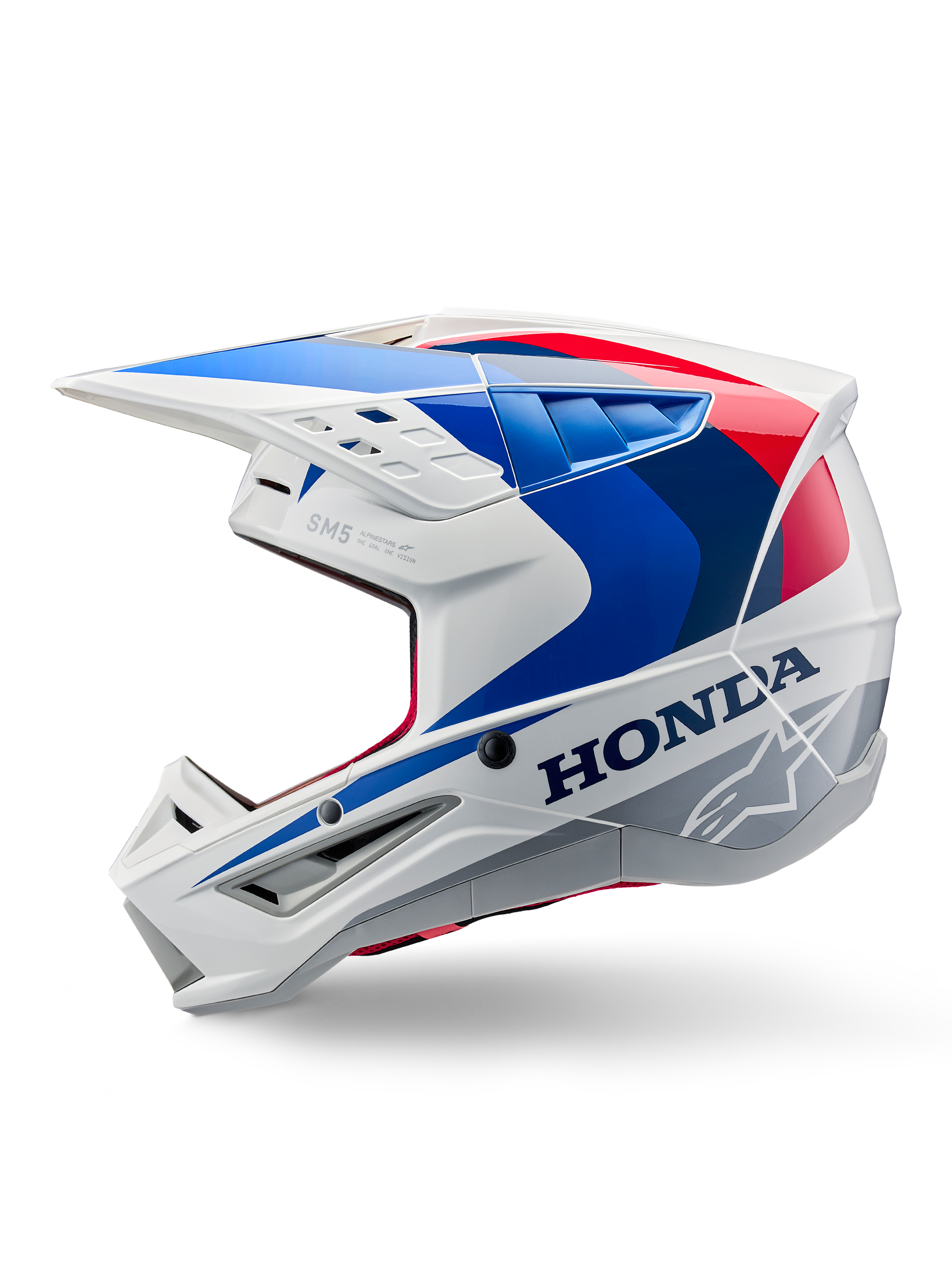 Casque Alpinestars Honda S-M5 ECE, blanc, bleu et rouge brillant, vue de profil, avec marquage Honda audacieux et logo étoile Alpinestars, design aérodynamique de motocross avec de multiples aérations et une visière proéminente, finition brillante