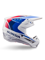 Alpinestars Honda S-M5 Helmet ECE, casque de motocross, blanc, bleu et rouge, vue de profil, design aérodynamique avec visière intégrée, nombreuses ouvertures de ventilation, finition brillante, marquage Honda et logo Alpinestars