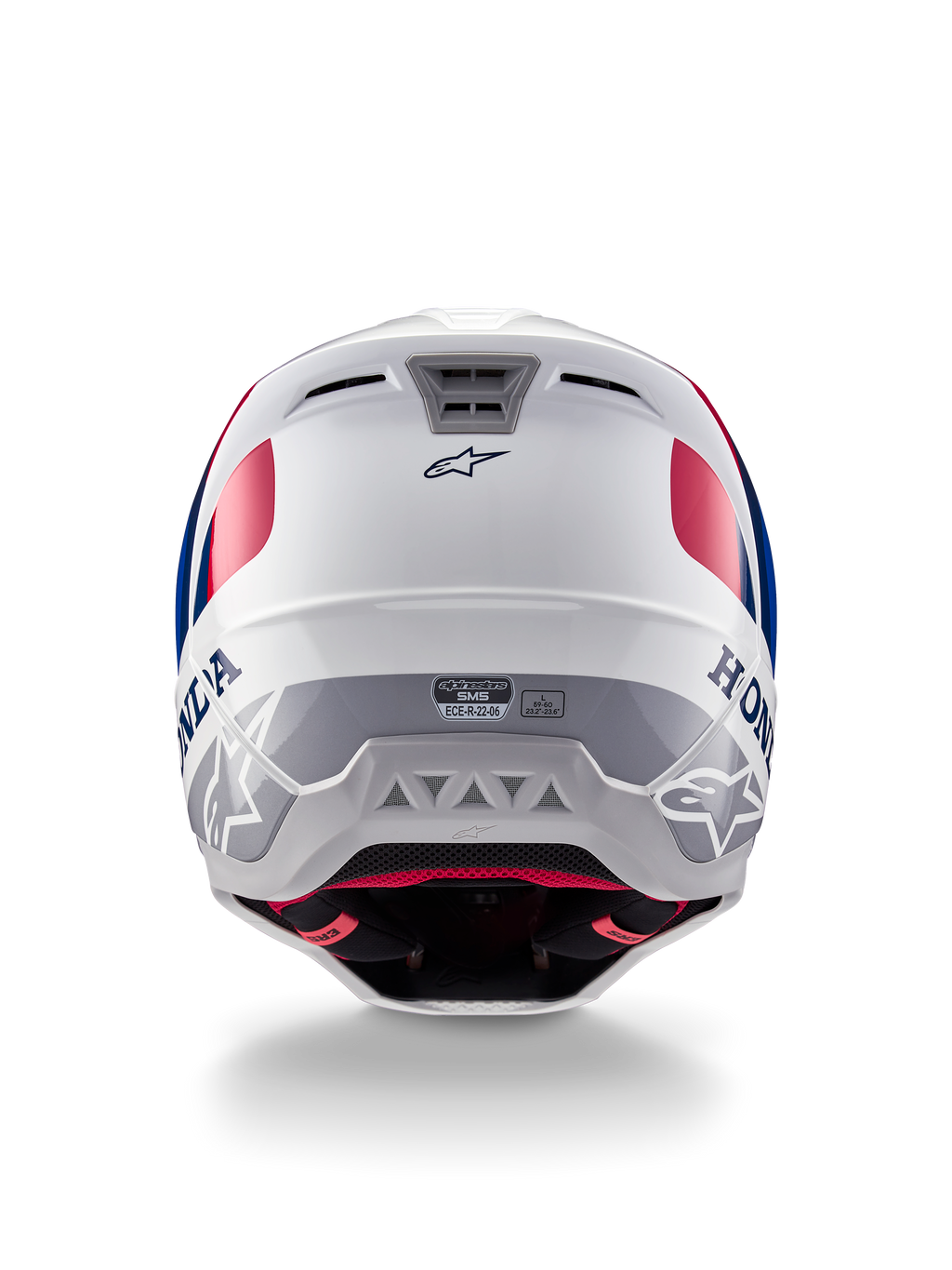 Casque Alpinestars Honda S-M5 ECE, casque de motocross, blanc, bleu et rouge brillant, vue arrière montrant les logos Honda et Alpinestars, coque profilée avec ports d'échappement de ventilation intégrés et étiquette de certification ECE.