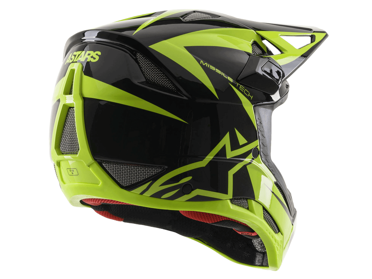 Casque intégral Alpinestars Missile Tech-Air, noir et jaune fluo brillant, vue de trois-quarts arrière présentant de larges ouvertures de ventilation en maille, logo ASTARS et doublure intérieure rouge, conçu pour la performance en VTT de descente.