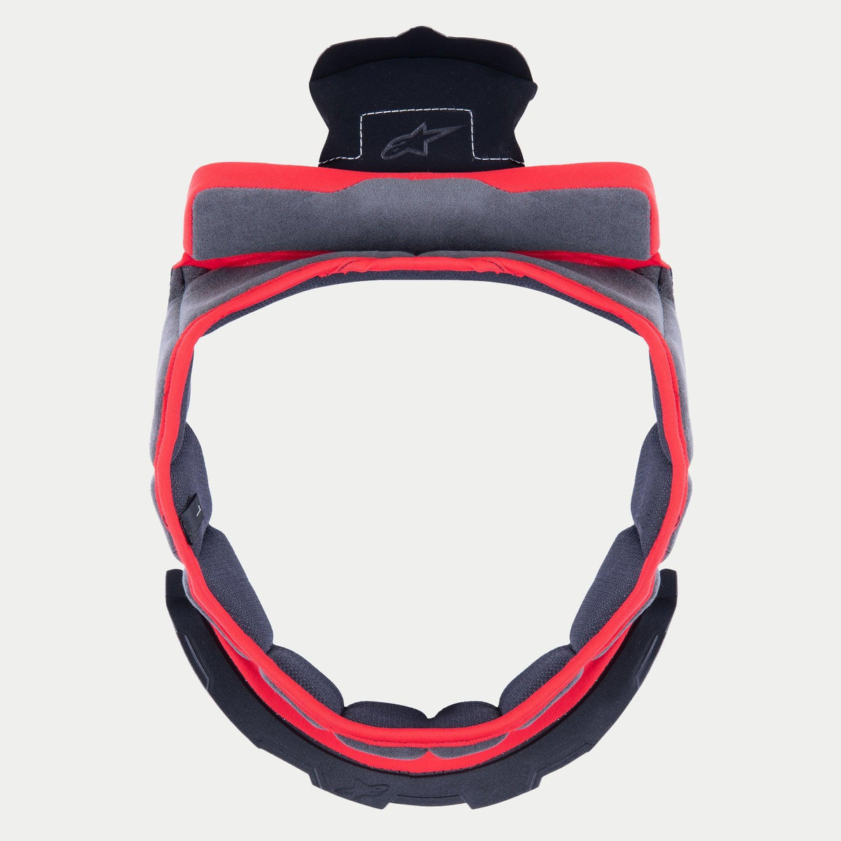 Alpinestars Supertech R10 Crown Pad, rembourrage intérieur de rechange pour casque, tissu doux gris avec bordure rouge et pattes de fixation noires, design circulaire pour casques S-R10, avec logo étoile brodé sur la languette supérieure.