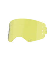 Alpinestars Supertech Roll Off Lens, Motocross Goggle Accessory, Clear Yellow, featuring horizontal glide lines and side attachment points for roll-off systems, curved impact-resistant polycarbonate design