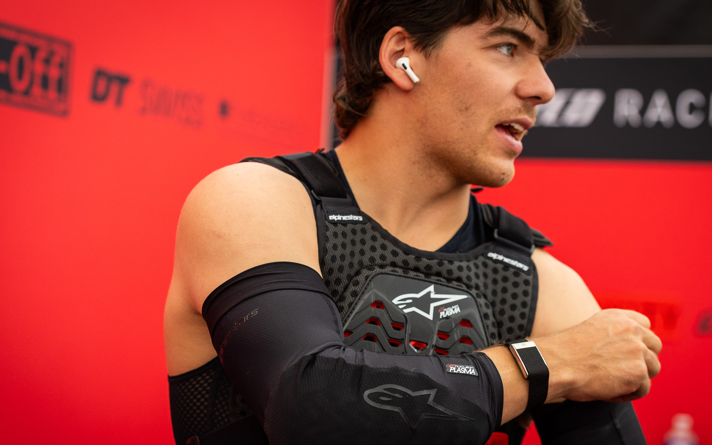 Finn Iles in the paddock wearing Alpinestars plasma chest protector