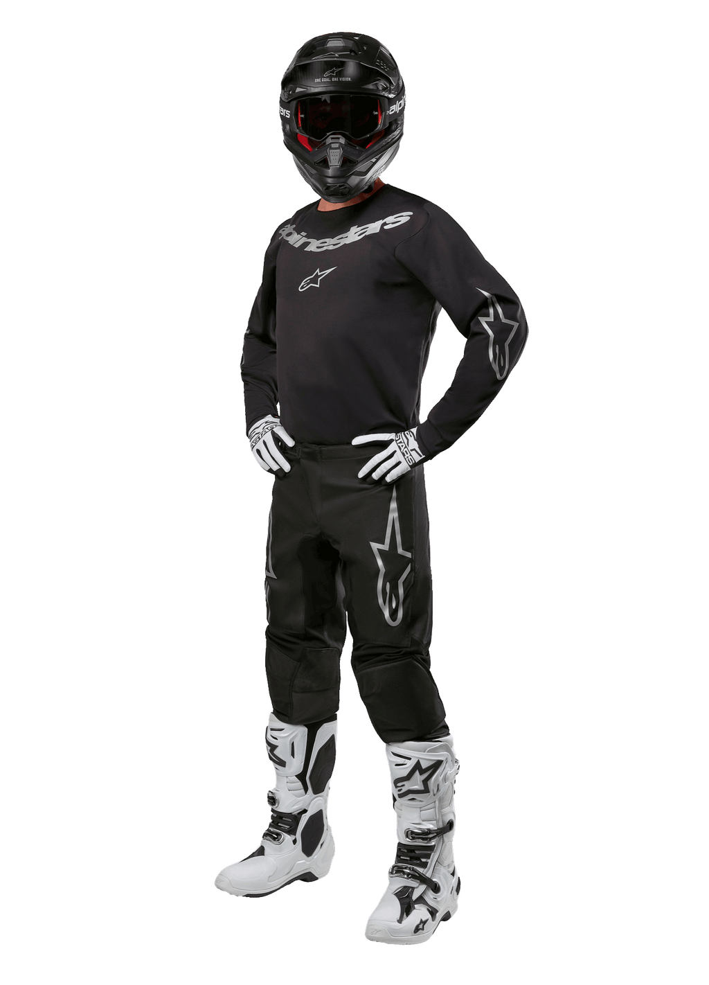 Alpinestars 2024 Fluid Graphite Gear Set, tenue de motocross complète, noir avec logos gris et blancs, comprenant un maillot et un pantalon portés avec un casque noir assorti, des gants et des bottes blancs et noirs, conçu pour la protection tout-terrain