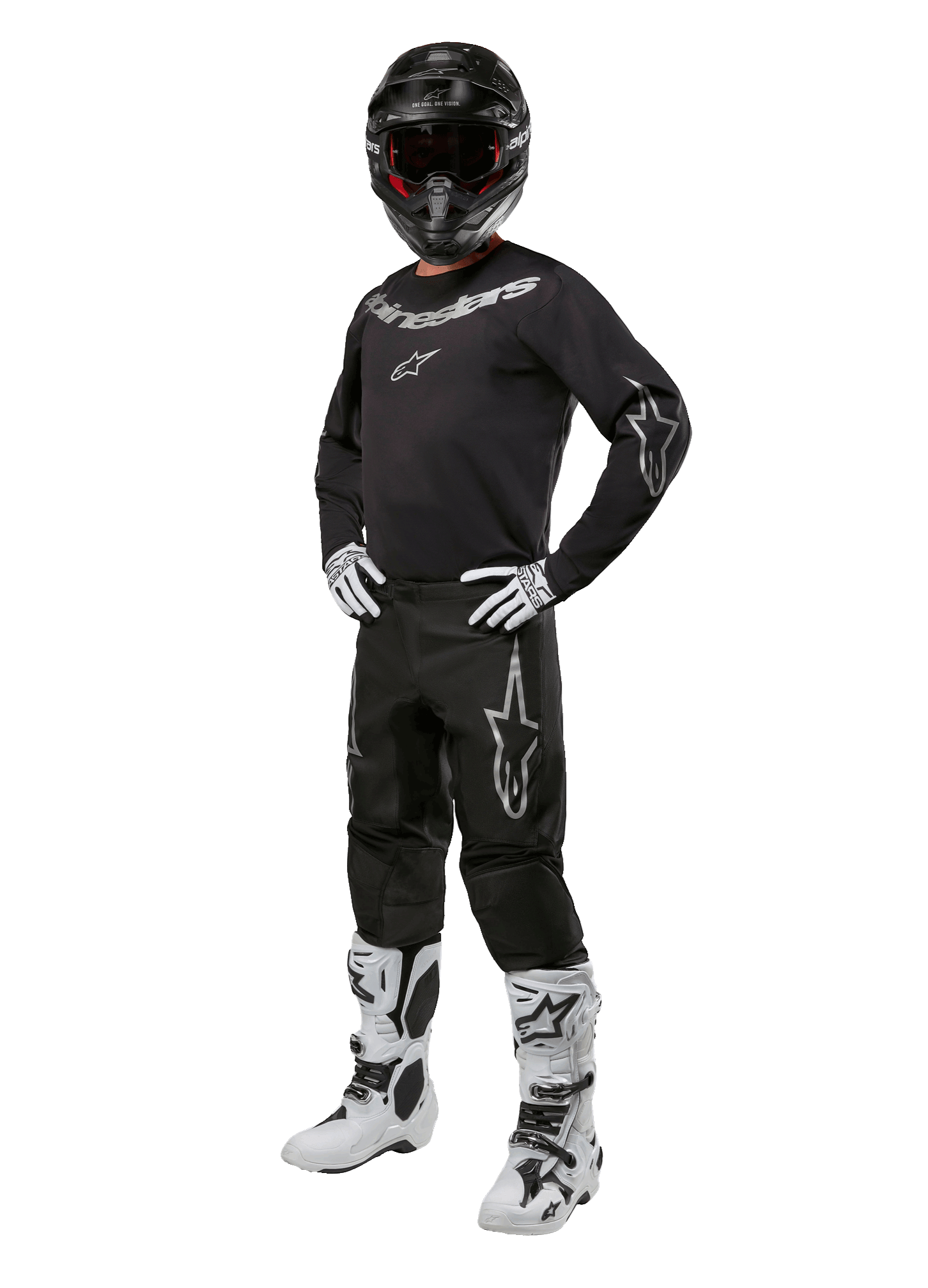 Alpinestars 2024 Fluid Graphite Gear Set, tenue de motocross complète, noir avec logos gris et blancs, comprenant un maillot et un pantalon portés avec un casque noir assorti, des gants et des bottes blancs et noirs, conçu pour la protection tout-terrain