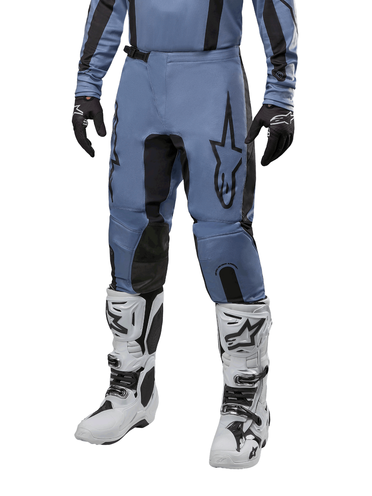 Alpinestars 2024 Fluid Lurv Pants, Motocross Pants, Light Blue and Black, worn with matching long-sleeve jersey and white motocross boots, featuring a prominent black star logo on the thigh and reinforced inner knee panels, front view on white background