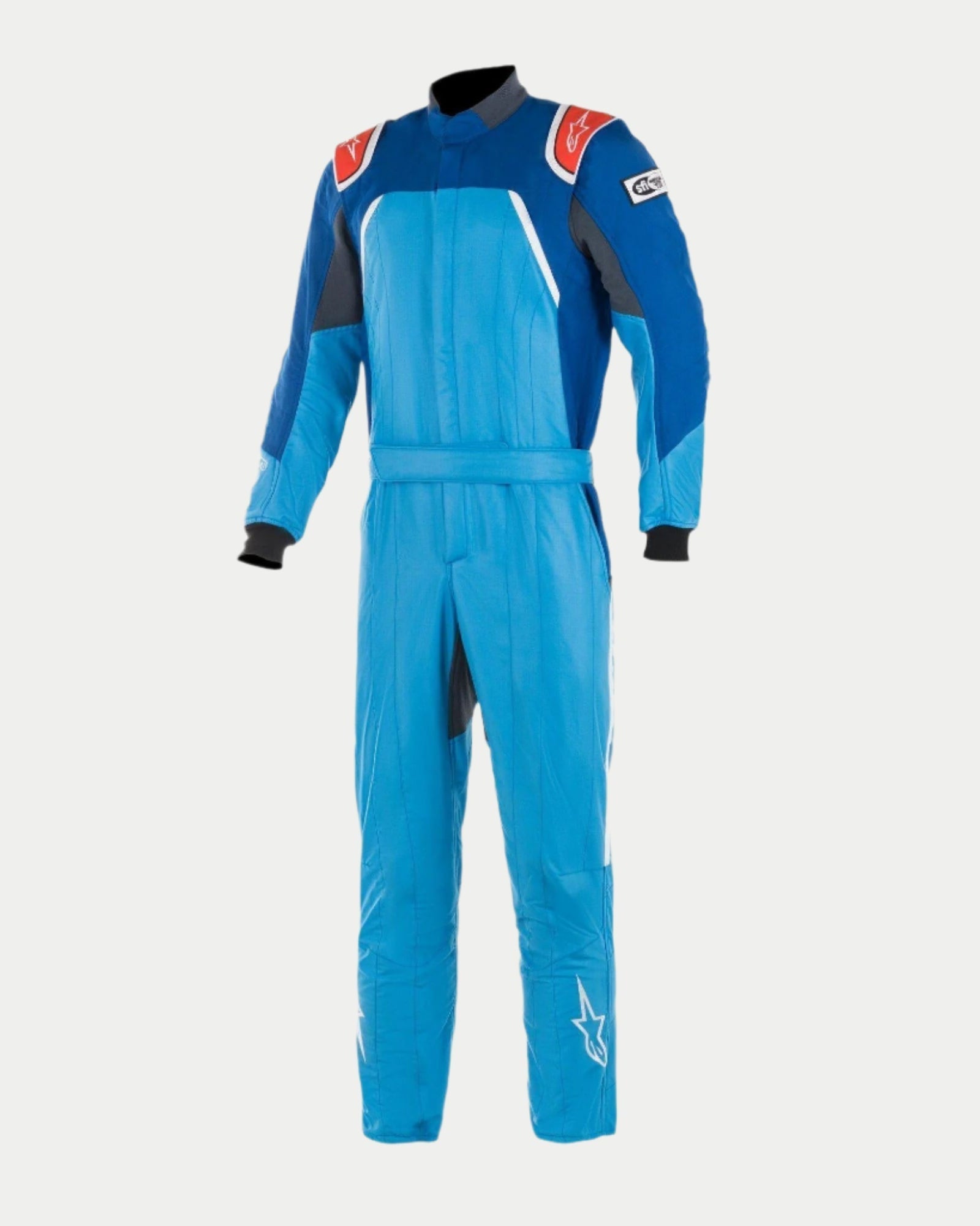 Alpinestars GP Pro Comp Bootcut Suit FIA, Professional Auto Racing Suit in Cobalt Blue, Royal Blue, and Red, featuring a three-layer aramidic construction, shoulder epaulettes, and a bootcut leg design with white star logos.