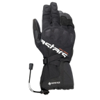 Gants Alpinestars XT-5 GORE-TEX, gants de moto noirs, avec logo Astars blanc et inscription ADV-TECH orange, manchette longue avec protection des articulations recouverte, logo GORE-TEX et fermeture par cordon élastique, équipement de touring aventure